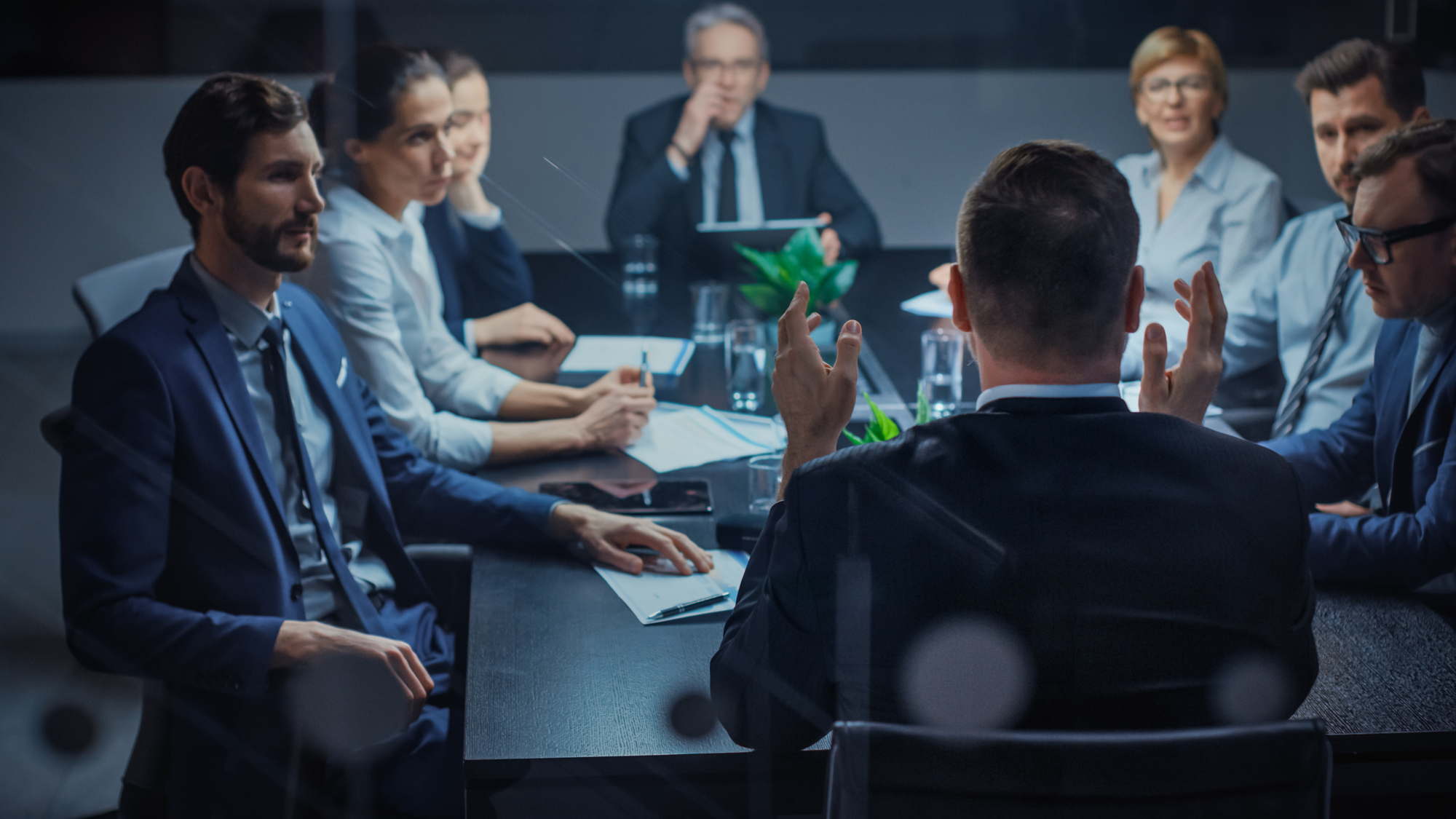 Man speaking at conference table