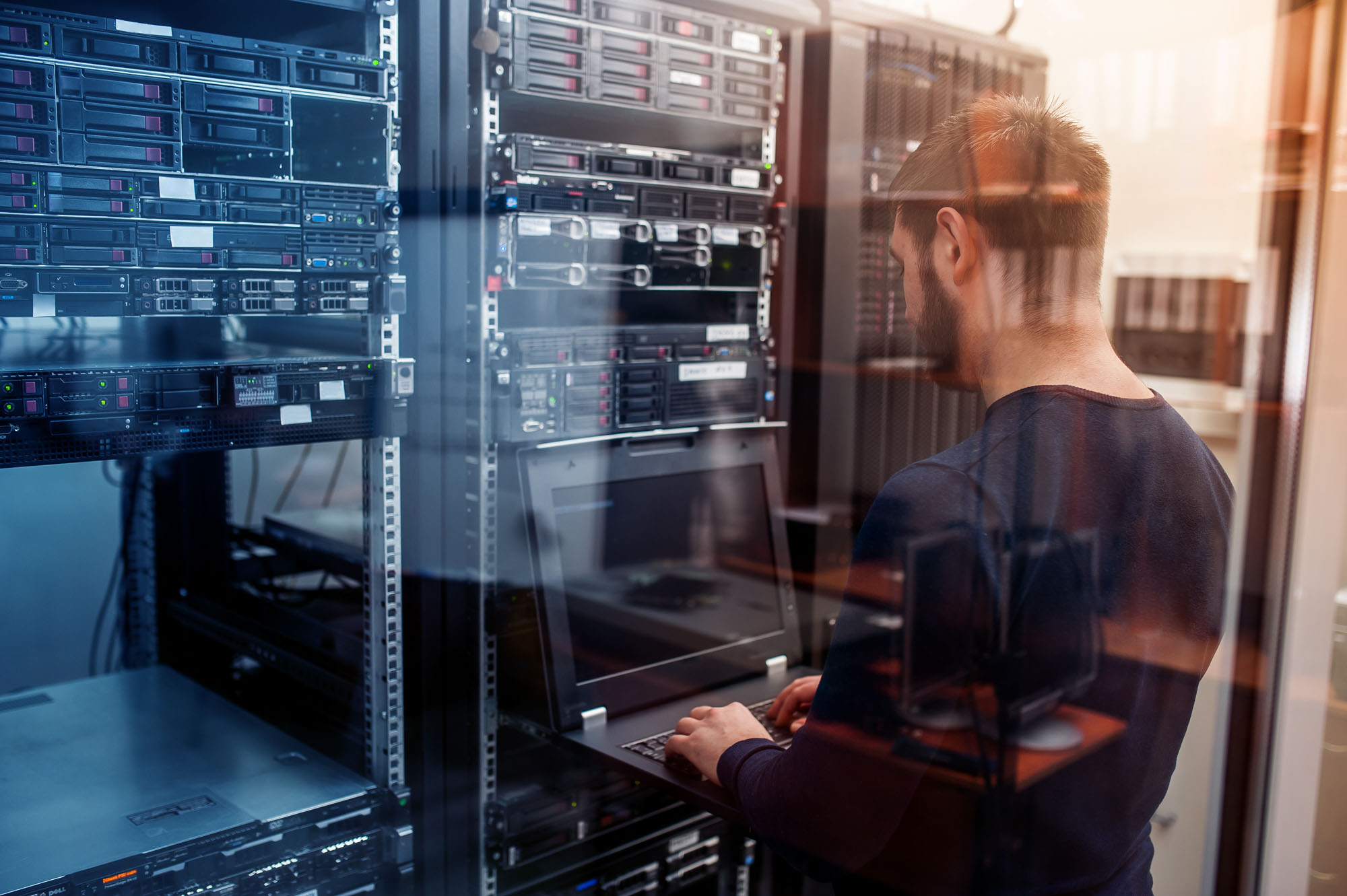 Man working on a server rack