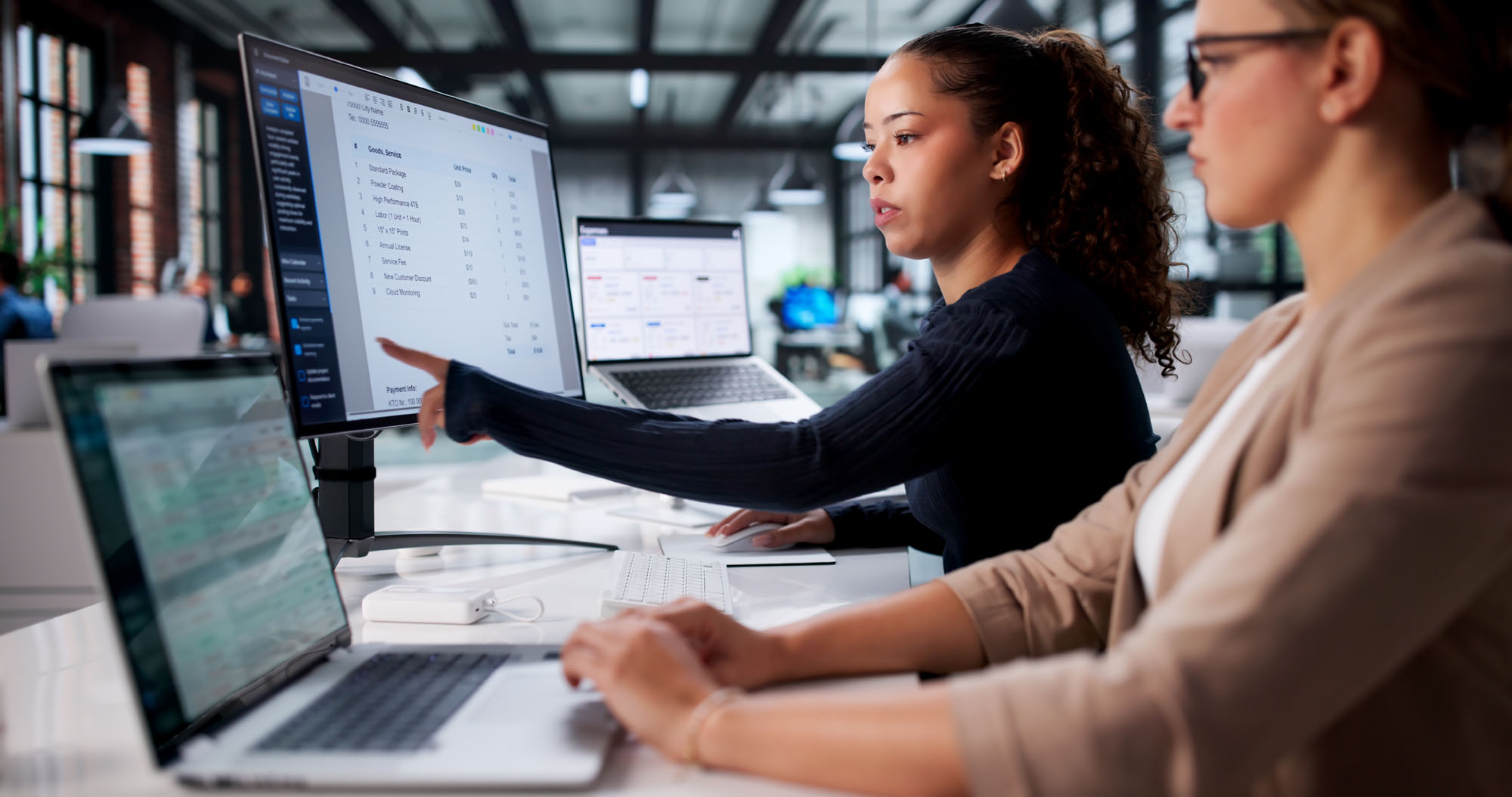 2 people working at a computer